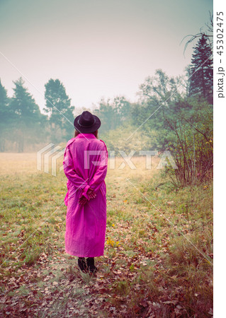 Girl in vintage pink coat and hat Girl in vintage pink coat and hat 45302475
