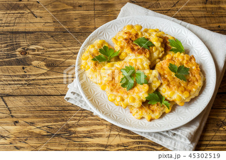 Cutlets from grains of canned corn with parsley  45302519