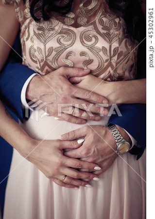 hands of the bridegroom on the belly of the bride hands of the bridegroom on the belly of the bride 45302961