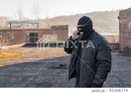a bandit talking on the phone 45306574