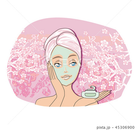 Beautiful woman is applying purifying  mask  45306900