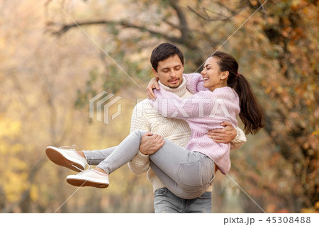 Couple in love in the autumn leaves 45308488