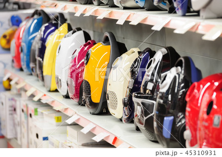 vacuum cleaners in appliance store arranged in a row 45310931
