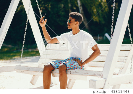 Black guy in a summer park 45315443
