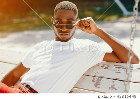 Black guy in a summer park 45315449