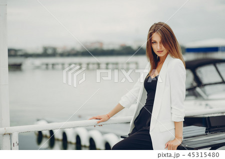 Fashion girl near water 45315480