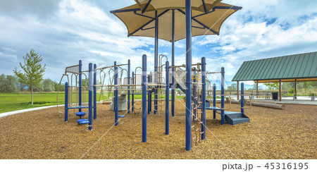 Childrens playground under cloudy sky in Lehi Utah Childrens playground under cloudy sky in Lehi Utah 45316195