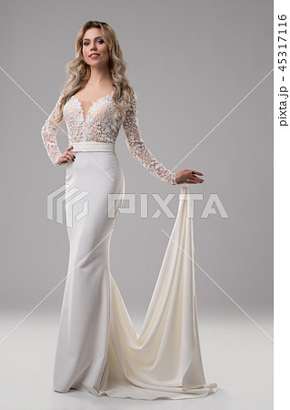 Pretty blonde in luxurious dress with train Pretty blonde in luxurious dress with train 45317116