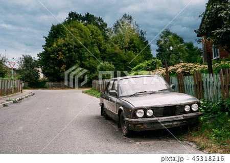 Luxury Sedan Car With Damages After Accident Abandoned In Villag Luxury Sedan Car With Damages After Accident Abandoned In Villag 45318216