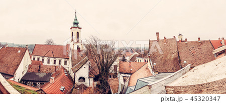 Annunciation church and red roofs of old houses 45320347