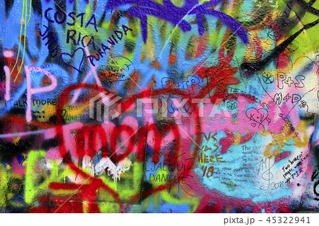 Detail of bright colorful wall with graffiti Detail of bright colorful wall with graffiti 45322941