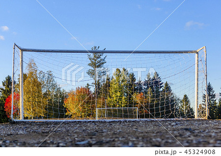 Poor empty football field with two football goals Poor empty football field with two football goals 45324908