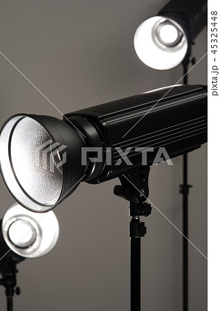 Black studio illuminators on a grey background 45325448