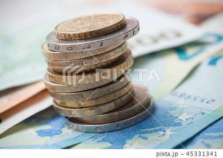 closeup of coins piles and banknote in euro money 45331341