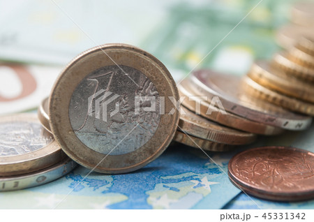 closeup of coins piles and banknote in euro money closeup of coins piles and banknote in euro money 45331342