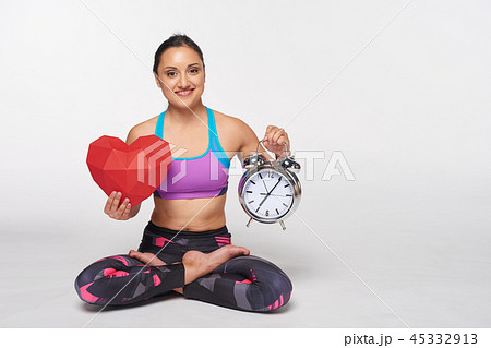 Woman sitting in yoga Padmasana, lotus pose Woman sitting in yoga Padmasana, lotus pose 45332913