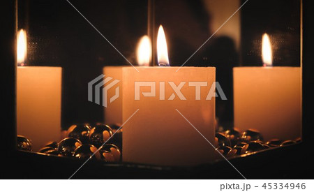 Christmas candle between mirrors 45334946