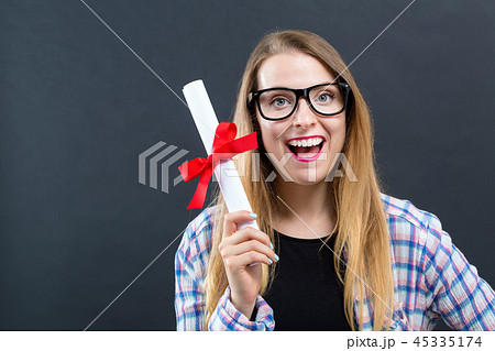Young woman with a graduation diploma Young woman with a graduation diploma 45335174
