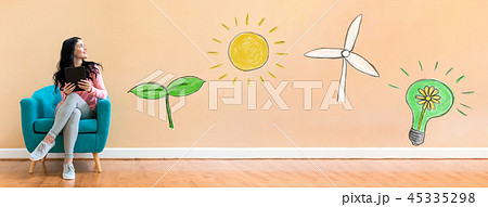 Ecology with woman using a tablet Ecology with woman using a tablet 45335298