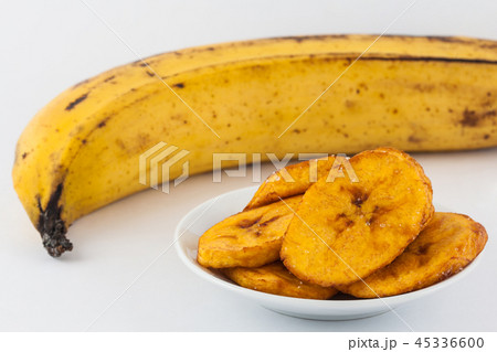 Fried half ripe plantain slices isolated Fried half ripe plantain slices isolated 45336600