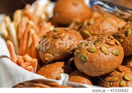 Fresh buns with seeds closeup 45336682
