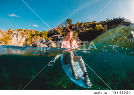 Happy surfer girl with surfboard. Happy surfer girl with surfboard. 45343630