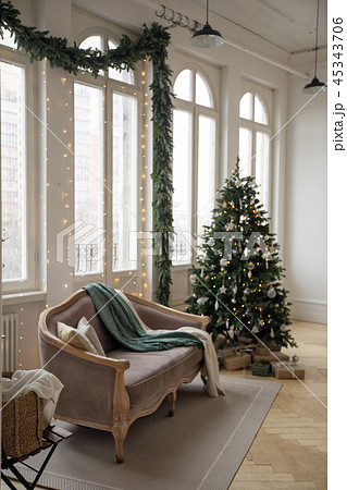 Sofa and Christmas tree near windows Sofa and Christmas tree near windows 45343706
