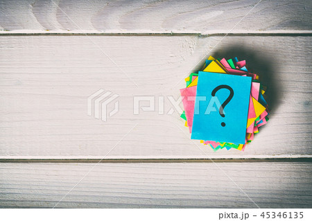 Just a lot of question marks on colored papers 45346135