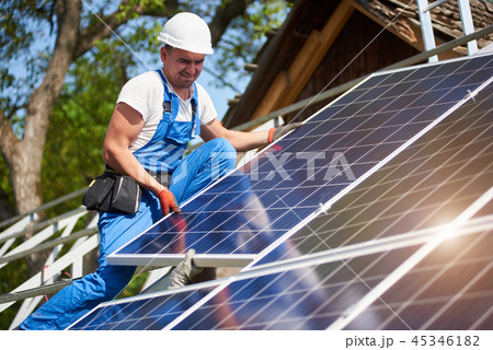 Stand-alone exterior solar panel system installation, renewable green energy generation concept. Stand-alone exterior solar panel system installation, renewable green energy generation concept. 45346182