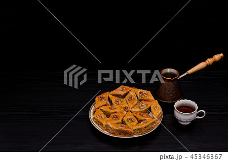 Cezve, coffee mug and a plate 45346367