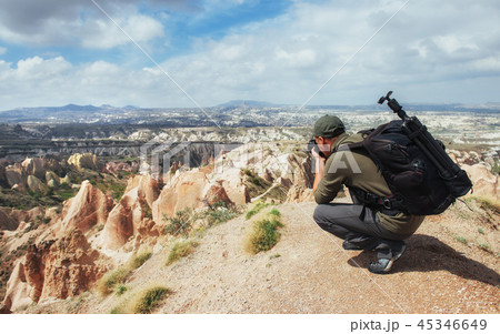 Photographer sandstone cliff and observing the natural landscape Photographer sandstone cliff and observing the natural landscape 45346649