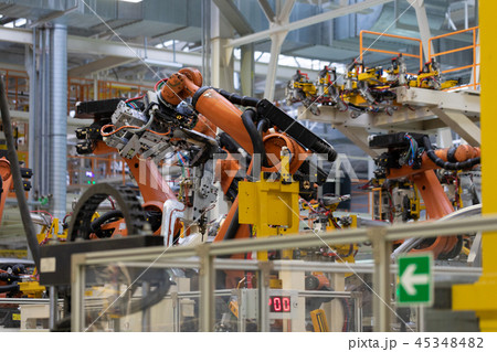 process of welding cars. Modern Assembly of cars at plant. automated build process of car body process of welding cars. Modern Assembly of cars at plant. automated build process of car body 45348482