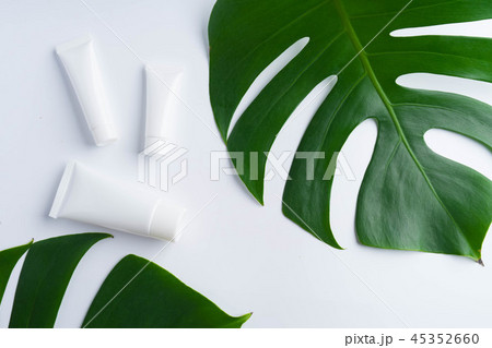 Beautiful natural cosmetics and leaves on light Beautiful natural cosmetics and leaves on light 45352660