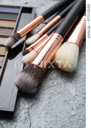 various makeup products on dark background 45352698