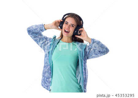 Young woman in headphones Young woman in headphones 45353295
