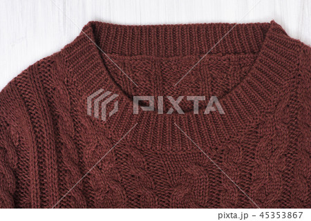Collar brown knitted sweater. Close up 45353867