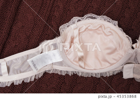 Beige lace bodice on knitted sweater. Inner side 45353868