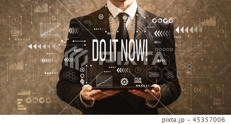 Do it now with businessman holding a tablet computer  45357006
