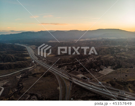 Desert asphalt road with cars. Aerial view  45357649