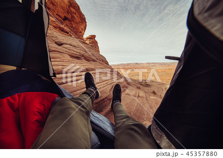 Man in the tent camping on the mountains 45357880