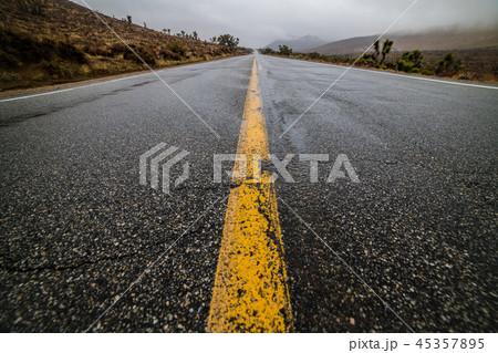 Empty wet desert asphalt pavement road Empty wet desert asphalt pavement road 45357895
