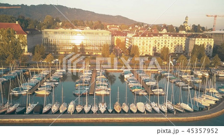 Aerial view of lake Zurich marina and moored sailboats inthe morning. Switzerland Aerial view of lake Zurich marina and moored sailboats inthe morning. Switzerland 45357952