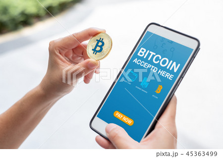 Hand holding gold bitcoin pay bill online store 45363499