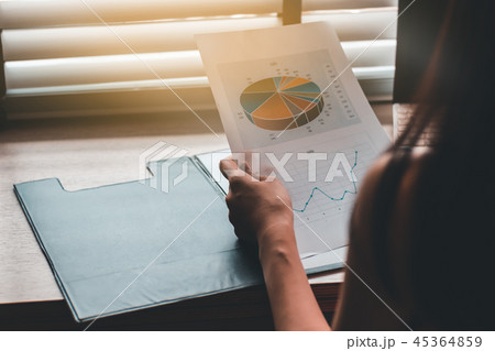Business people hand writing on business report 45364859