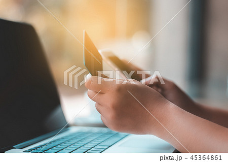 Hand holding credit card for online shopping 45364861