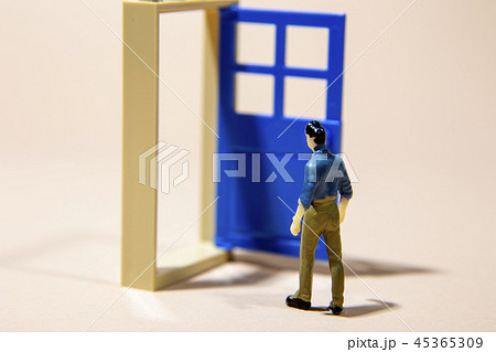 man standing in front of door into future man standing in front of door into future 45365309