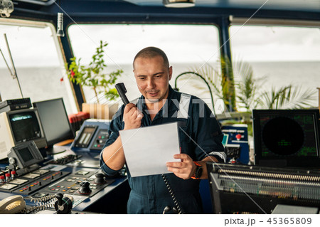 Marine navigational officer is reporting by VHF radio 45365809