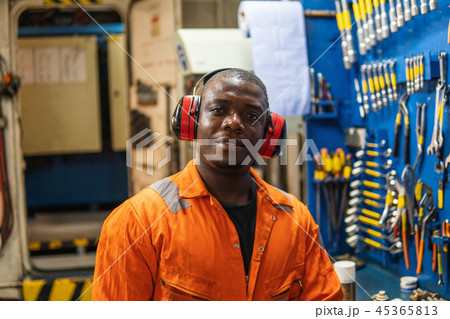 Marine engineer officer working in engine room 45365813