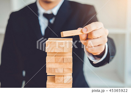Businessman plan and strategy Domino Effect Businessman plan and strategy Domino Effect 45365922