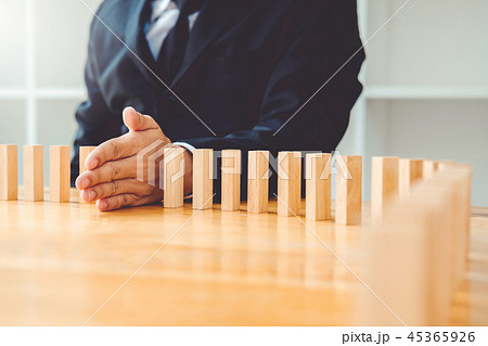 Businessman plan and strategy Domino Effect Businessman plan and strategy Domino Effect 45365926